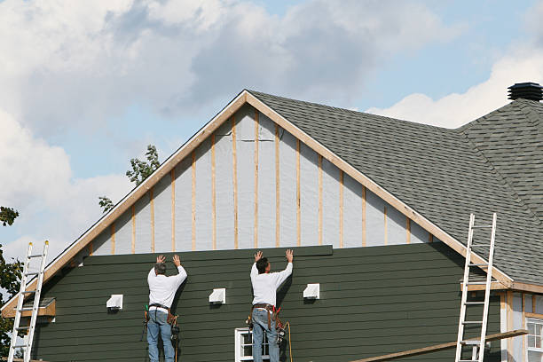 Professional Storm Damage Siding Repair technician working in Piqua, OH